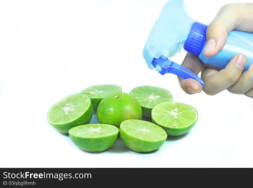 Green lemon water spray in white background. Green lemon water spray in white background.