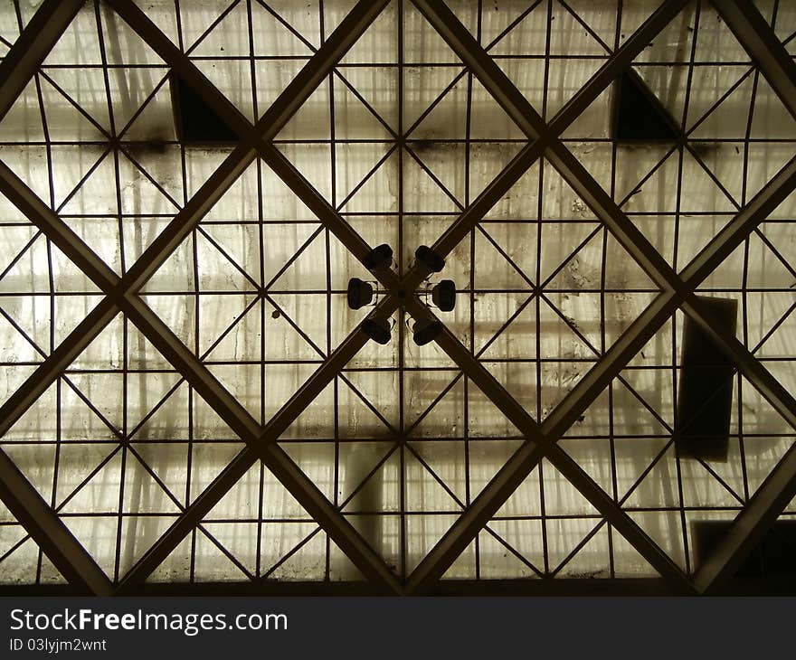 Sports hall roofs construction from interior made of concrete glass and steel. Sports hall roofs construction from interior made of concrete glass and steel