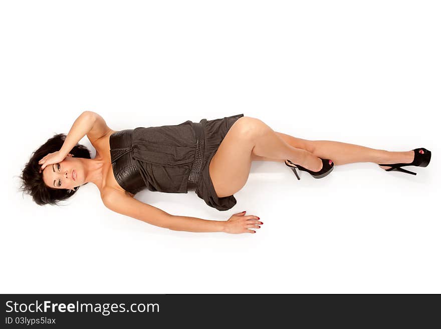 Woman in black dress lying down. isolated background. Woman in black dress lying down. isolated background