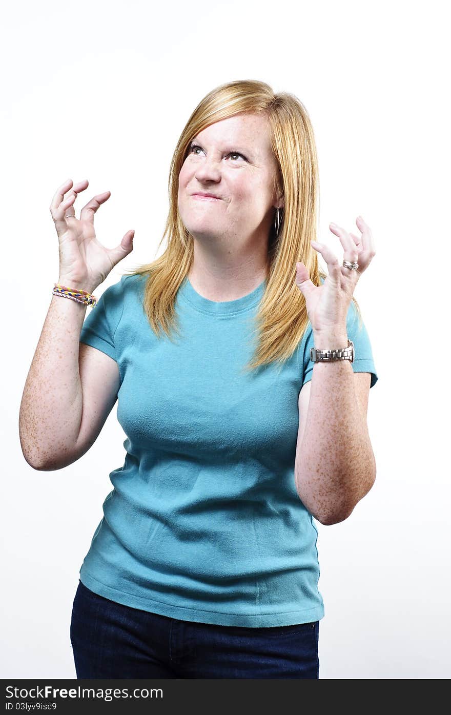 A woman looking up with a mad and stresses look. A woman looking up with a mad and stresses look.