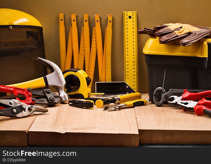 Big set of the working tools on hardwood board. Big set of the working tools on hardwood board