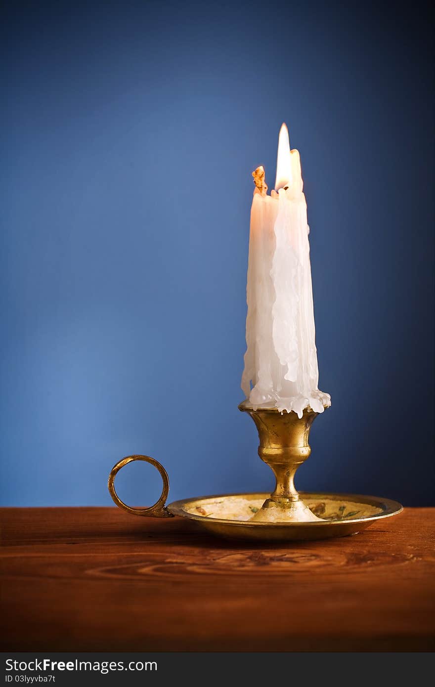 Copy space candle on blue background