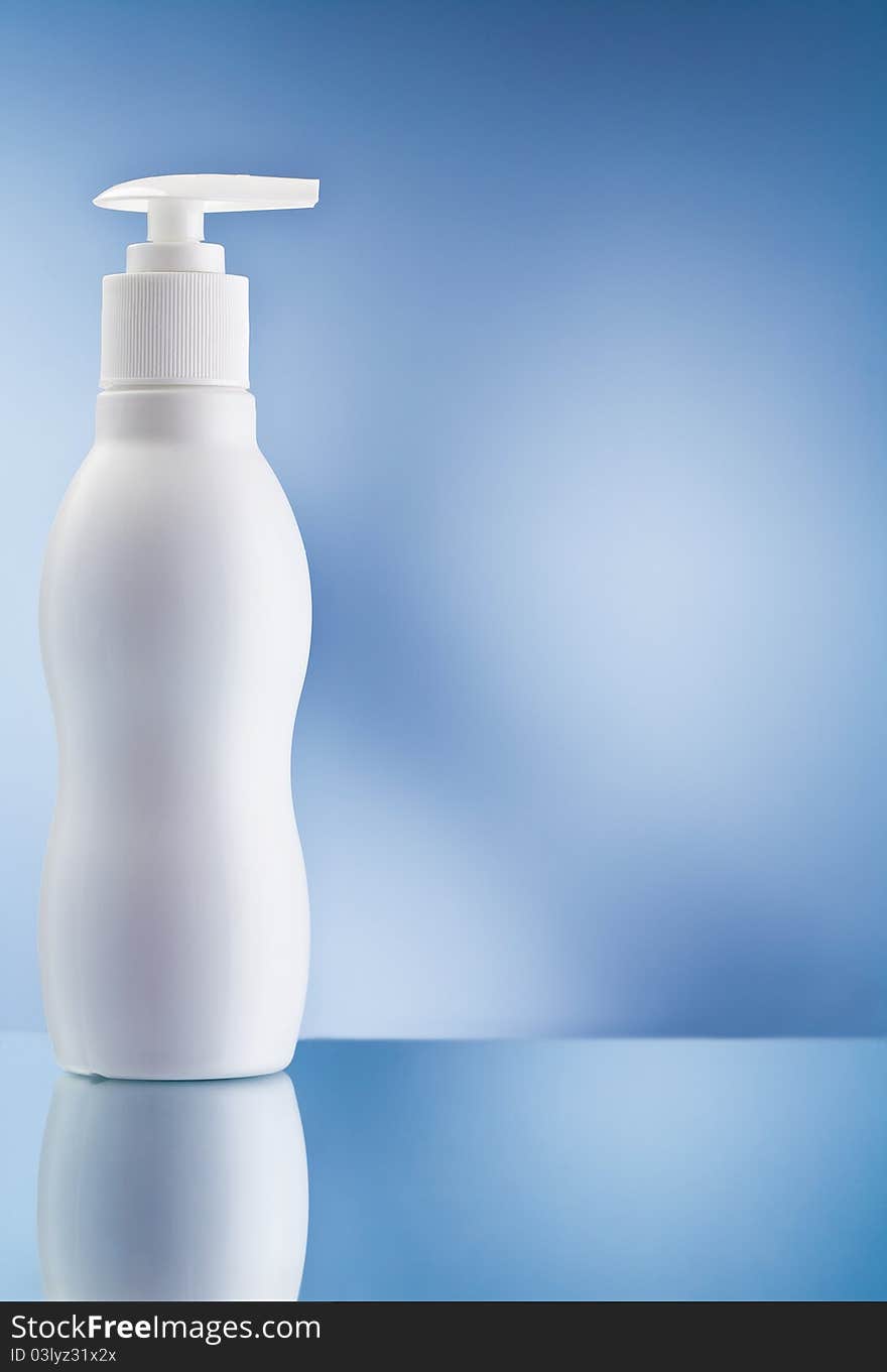 Copy space image of round skincare spray bottle