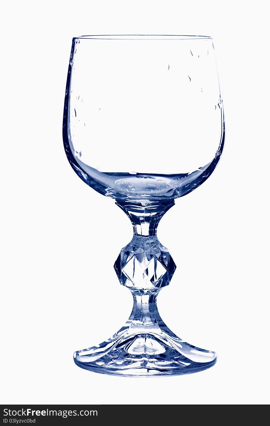 Empty wine glass in blue tones isolated over white