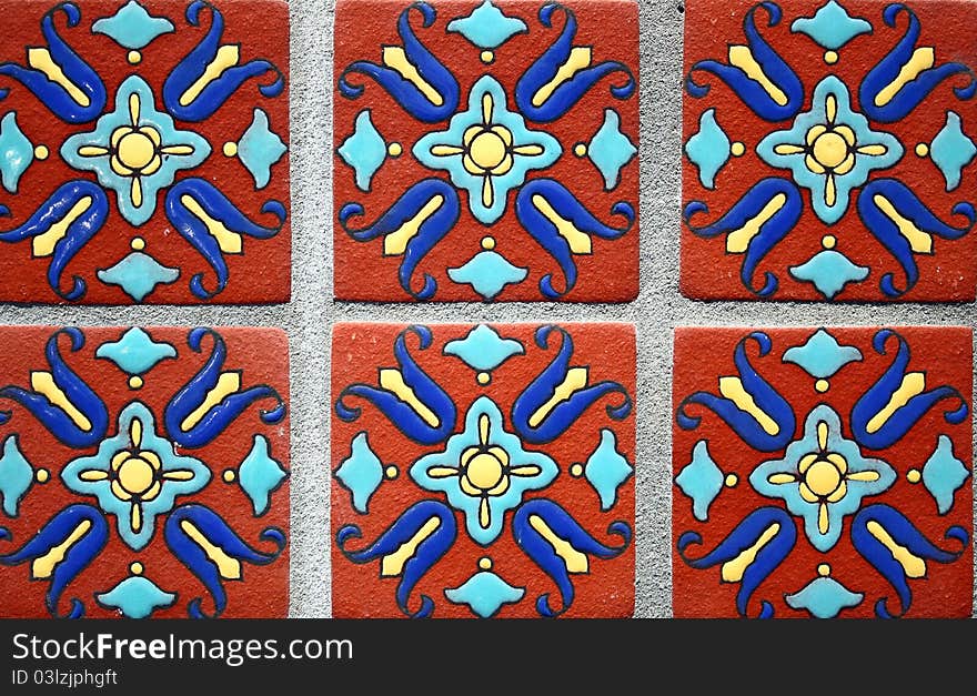 Six different colorful tiles, of the same design are shown covering the whole frame. Six different colorful tiles, of the same design are shown covering the whole frame.