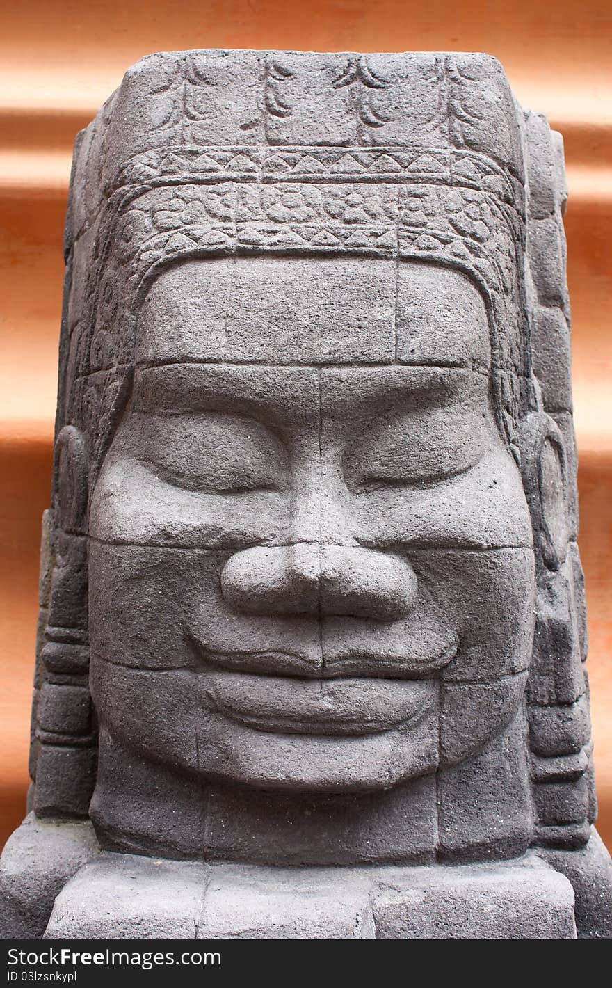 The statue's face. Stone carving Asian sculpture. The statue's face. Stone carving Asian sculpture.