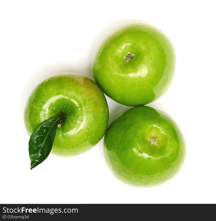 Green apples with leaves isolated on white