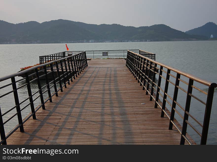 Dock and seascape at dusk