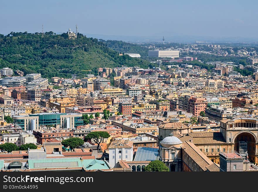 Aerial panorama above of houses rooftops in a Rome. Aerial panorama above of houses rooftops in a Rome