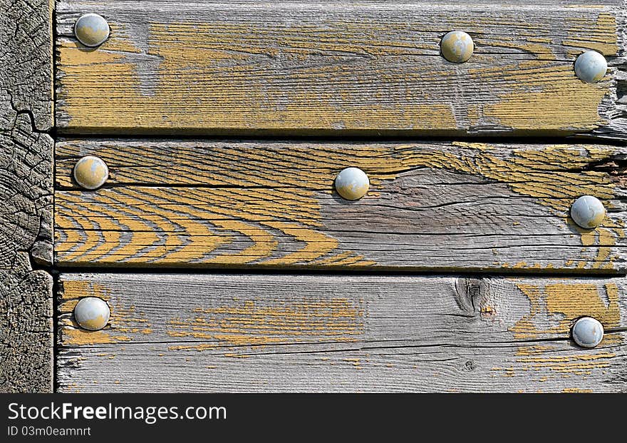 Old wooden panel with screws