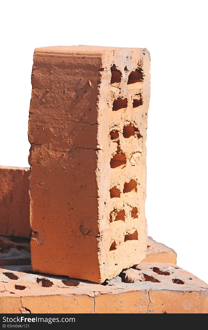 Stack of red bricks over white background