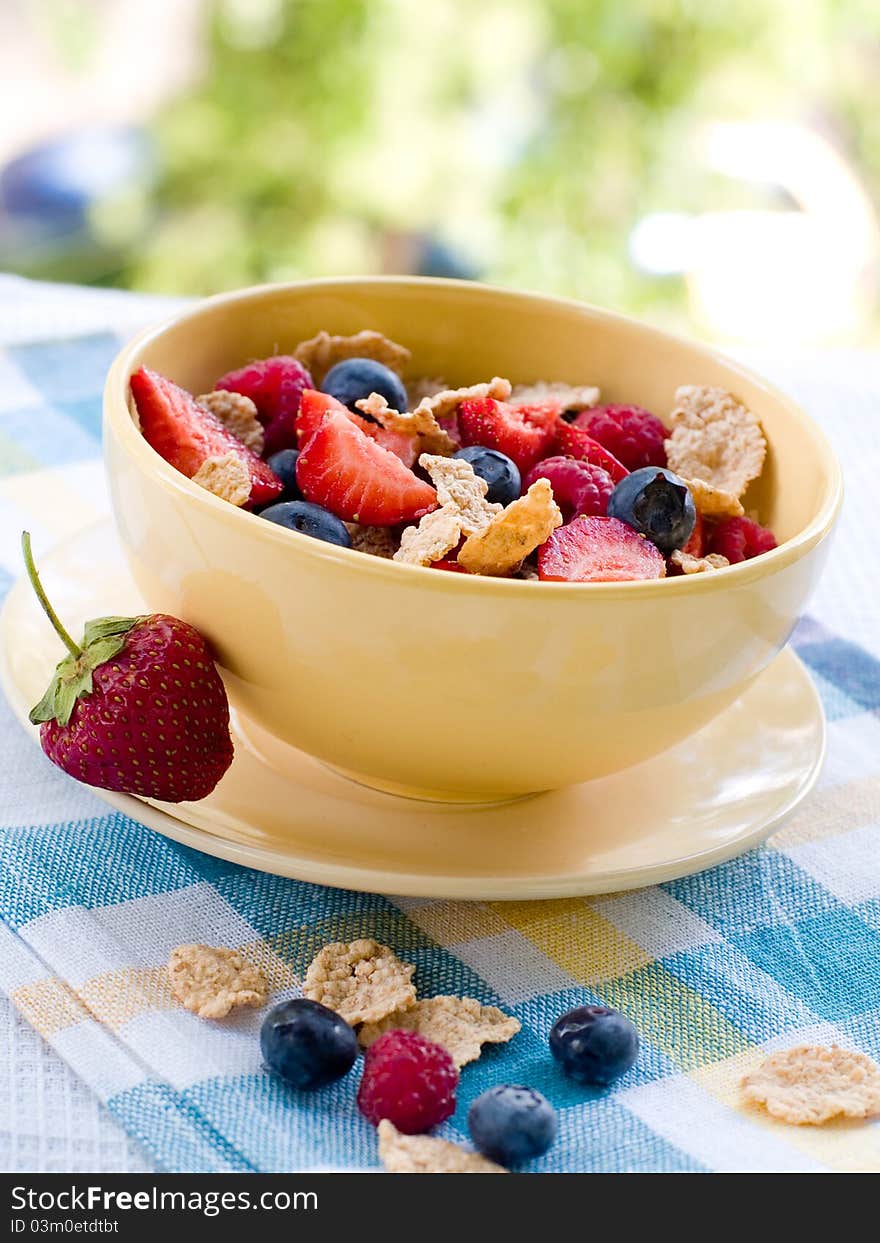 Corn flakes with fresh berries. Selective focus. Corn flakes with fresh berries. Selective focus