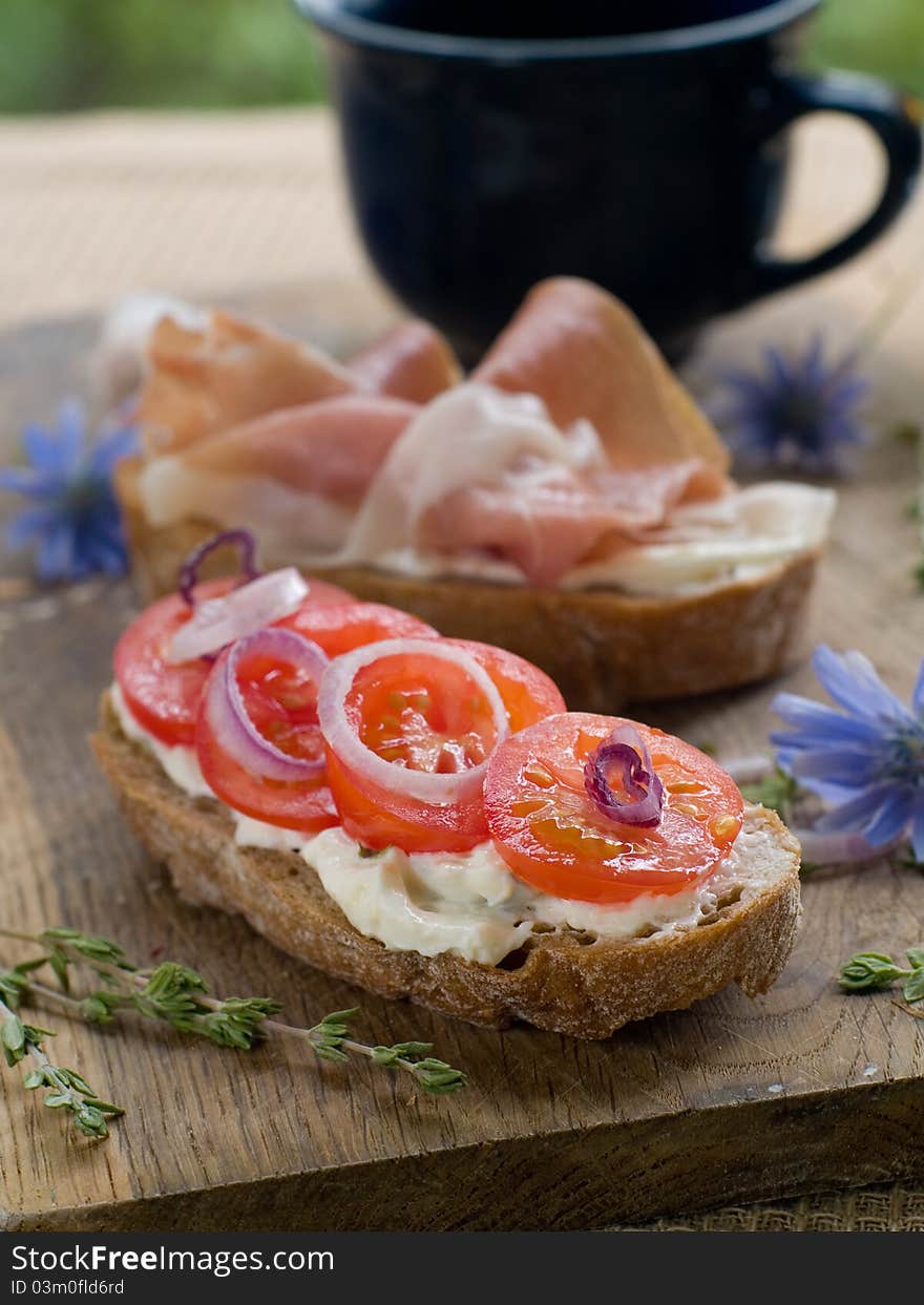 Healthy sandwich made with bread, tomato and ham slices. Selective focus. Healthy sandwich made with bread, tomato and ham slices. Selective focus