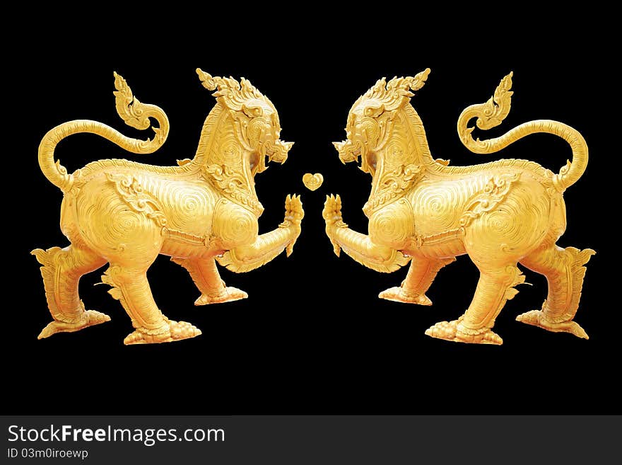 Golden Lion statue - Asian style art - isolated on black background. Golden Lion statue - Asian style art - isolated on black background.