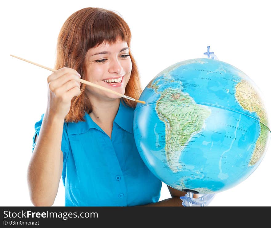 Red-haired girl is painting globe. Isolated on white background