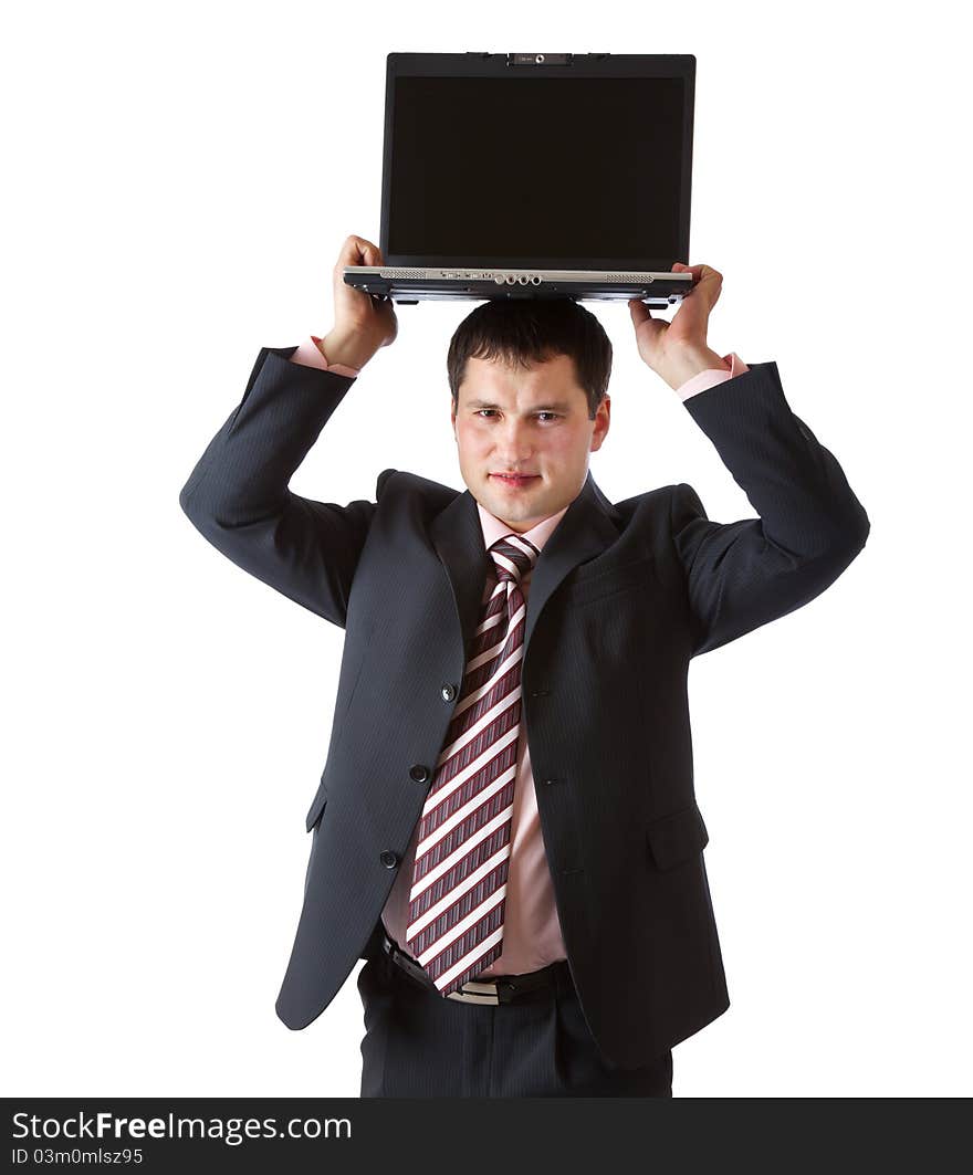 A businessman is holding the laptop above his head. Isolated on a white background