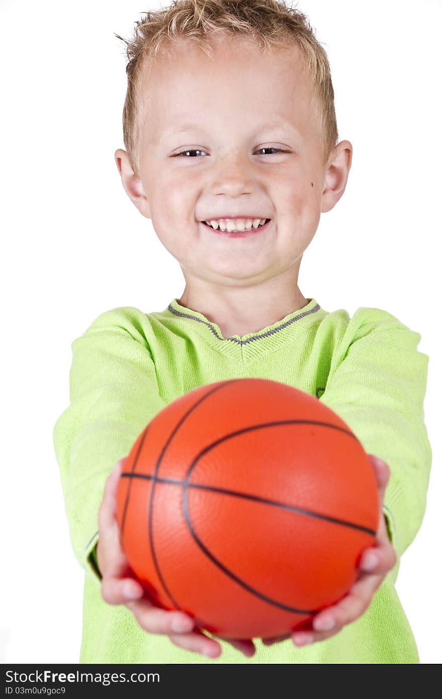 Happy boy showing basketball - isolated over white background