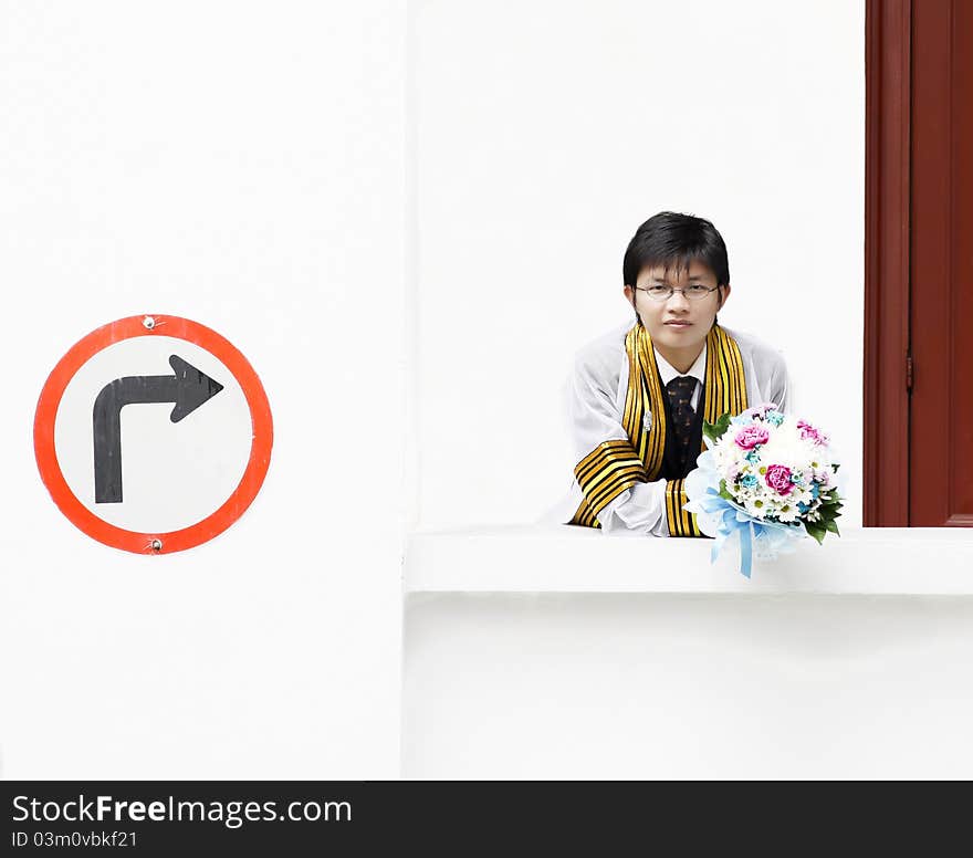 Everybody must have education concept with Man holding a flower on white background. Everybody must have education concept with Man holding a flower on white background.