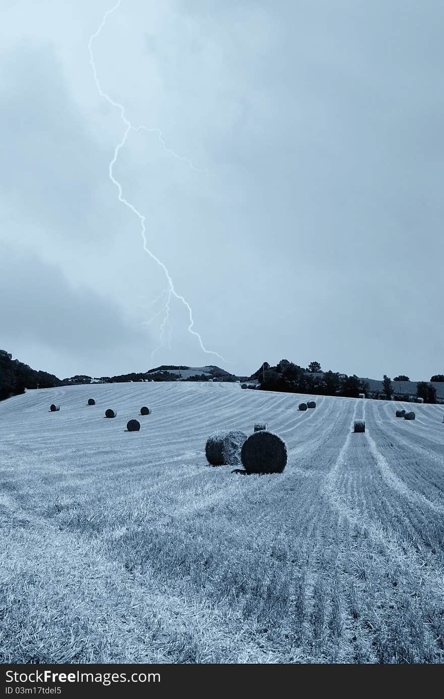 Wide countryside in the evening with cloudy sky