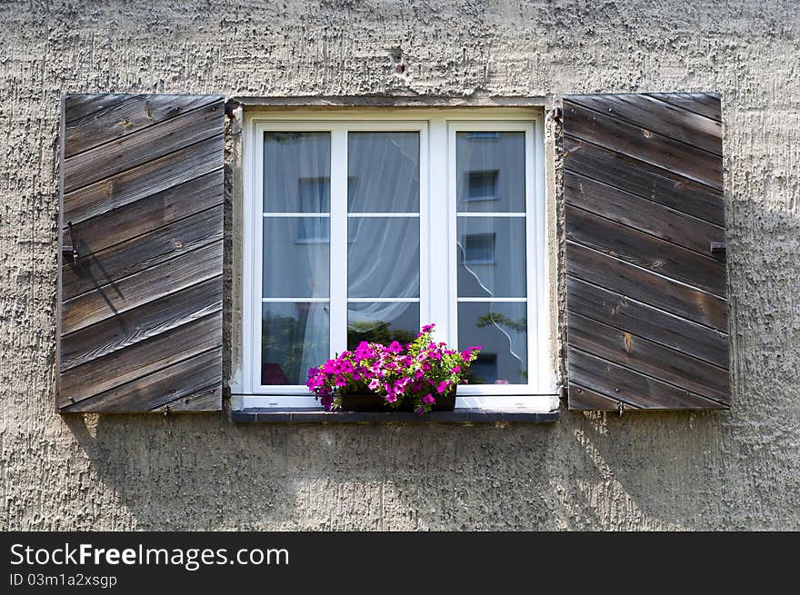 White, open window and pink flowers