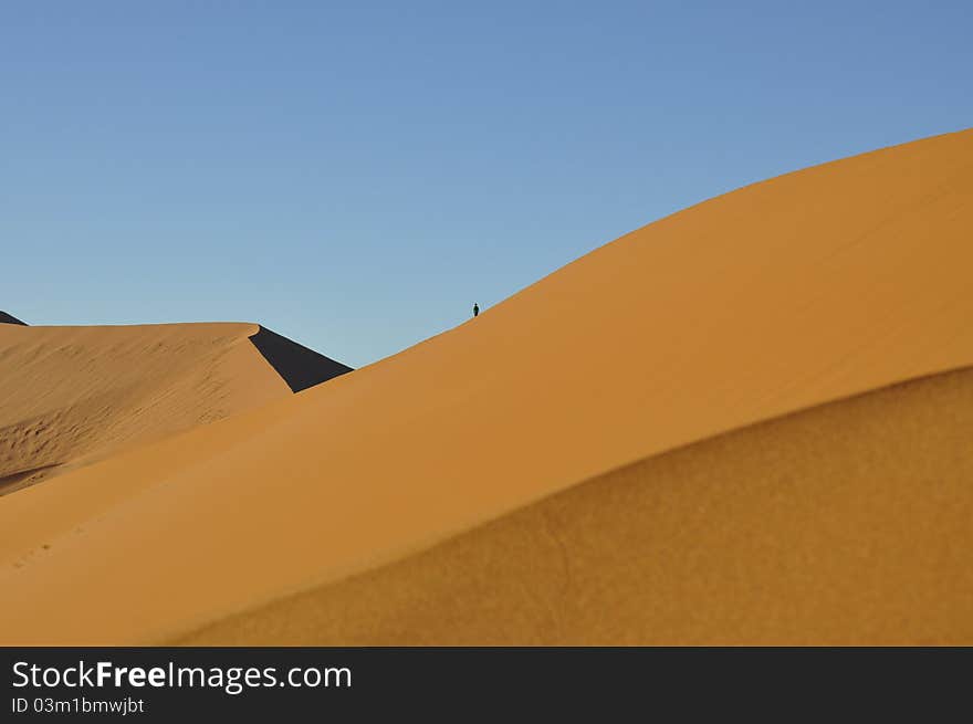 Lonely Man walking Golden Sand Dunes. Lonely Man walking Golden Sand Dunes