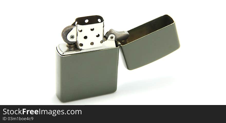 Zippo lighter is opened but no fire on white background