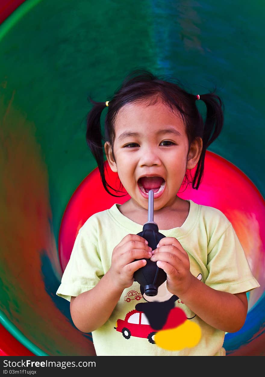 Children squeezed inflatable in colorful tunnel of the playgroun. Children squeezed inflatable in colorful tunnel of the playgroun