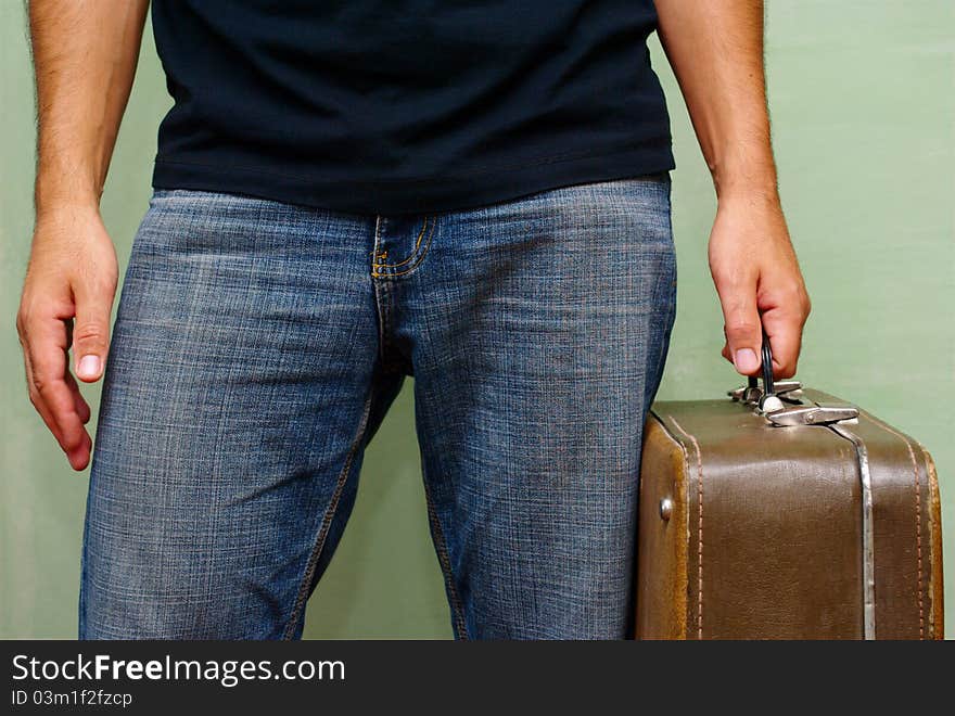 Case In A Man S Hand On A Green Background