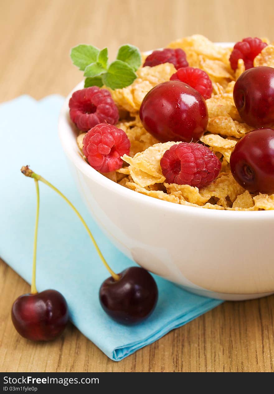 Corn flakes with raspberries and cherries. Corn flakes with raspberries and cherries