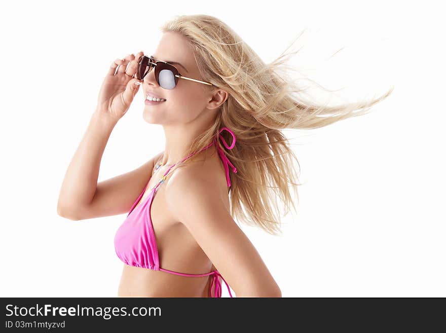 Young beautiful girl in sunglasses on white background