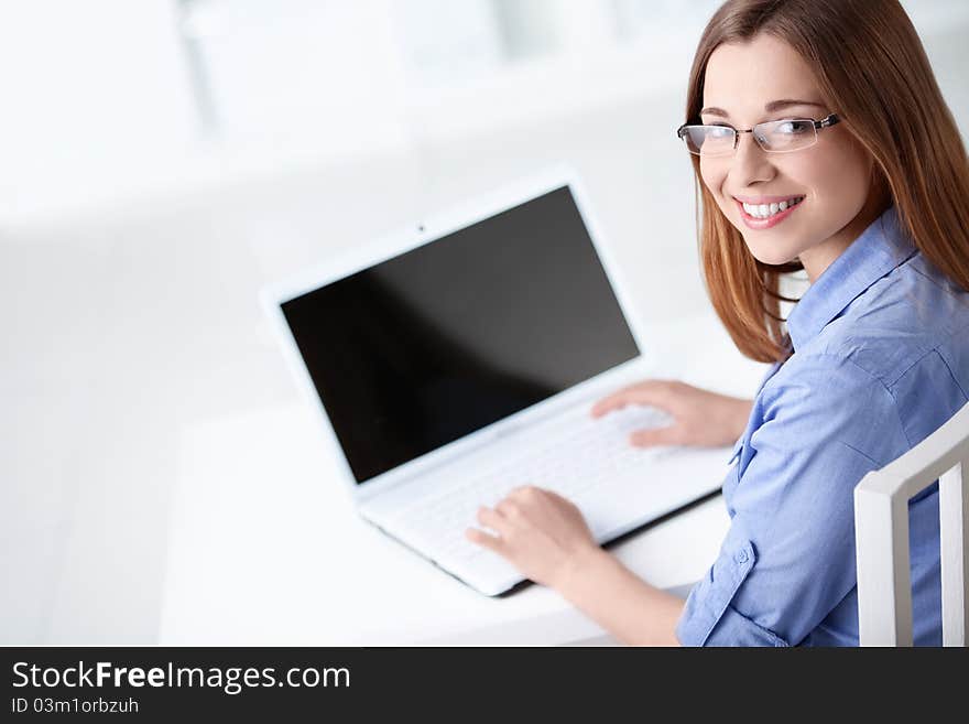 An attractive young girl with laptop. An attractive young girl with laptop