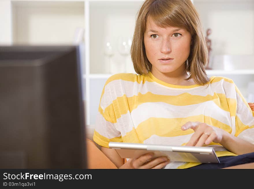 Woman chatting on the sofa using keyboard. Woman chatting on the sofa using keyboard