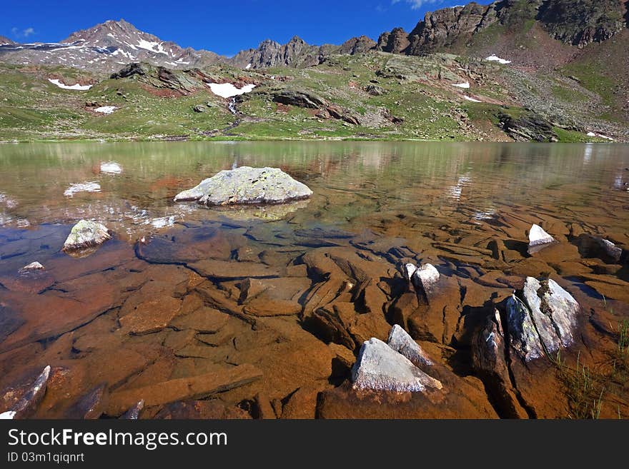 Small mountain lakes after a frozen night during summer. Small mountain lakes after a frozen night during summer