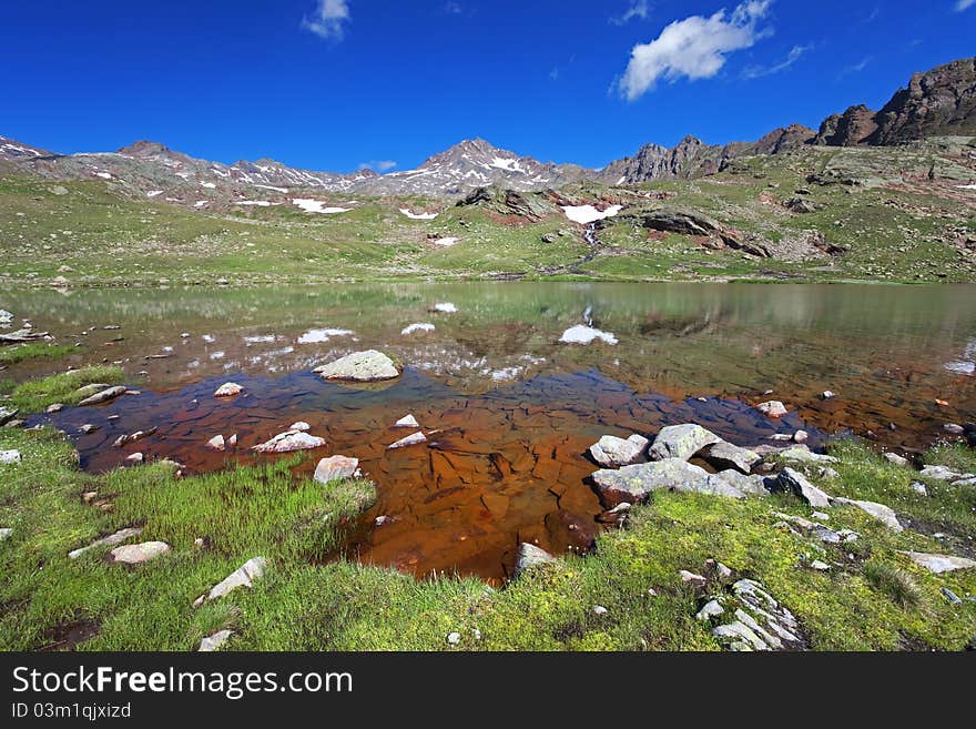 Small mountain lakes after a frozen night during summer. Small mountain lakes after a frozen night during summer