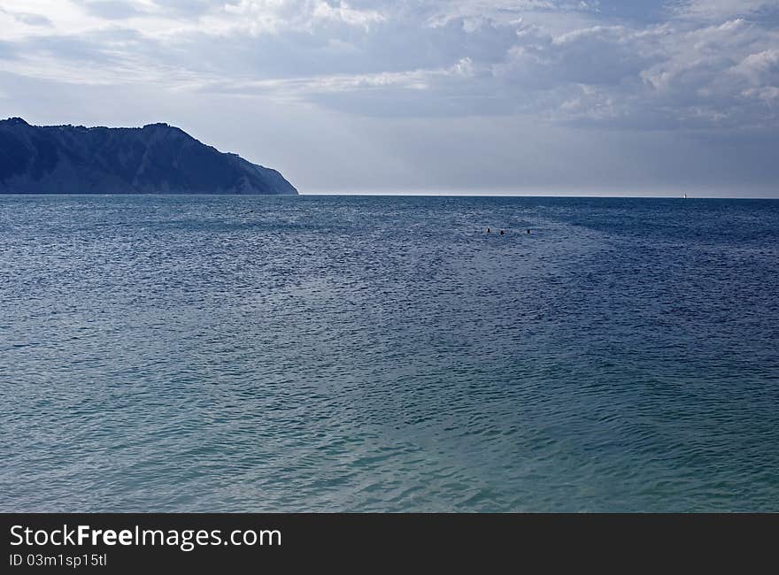 Adriatic Sea in front of the Napoleonic Fort with the Conero on the left. Adriatic Sea in front of the Napoleonic Fort with the Conero on the left