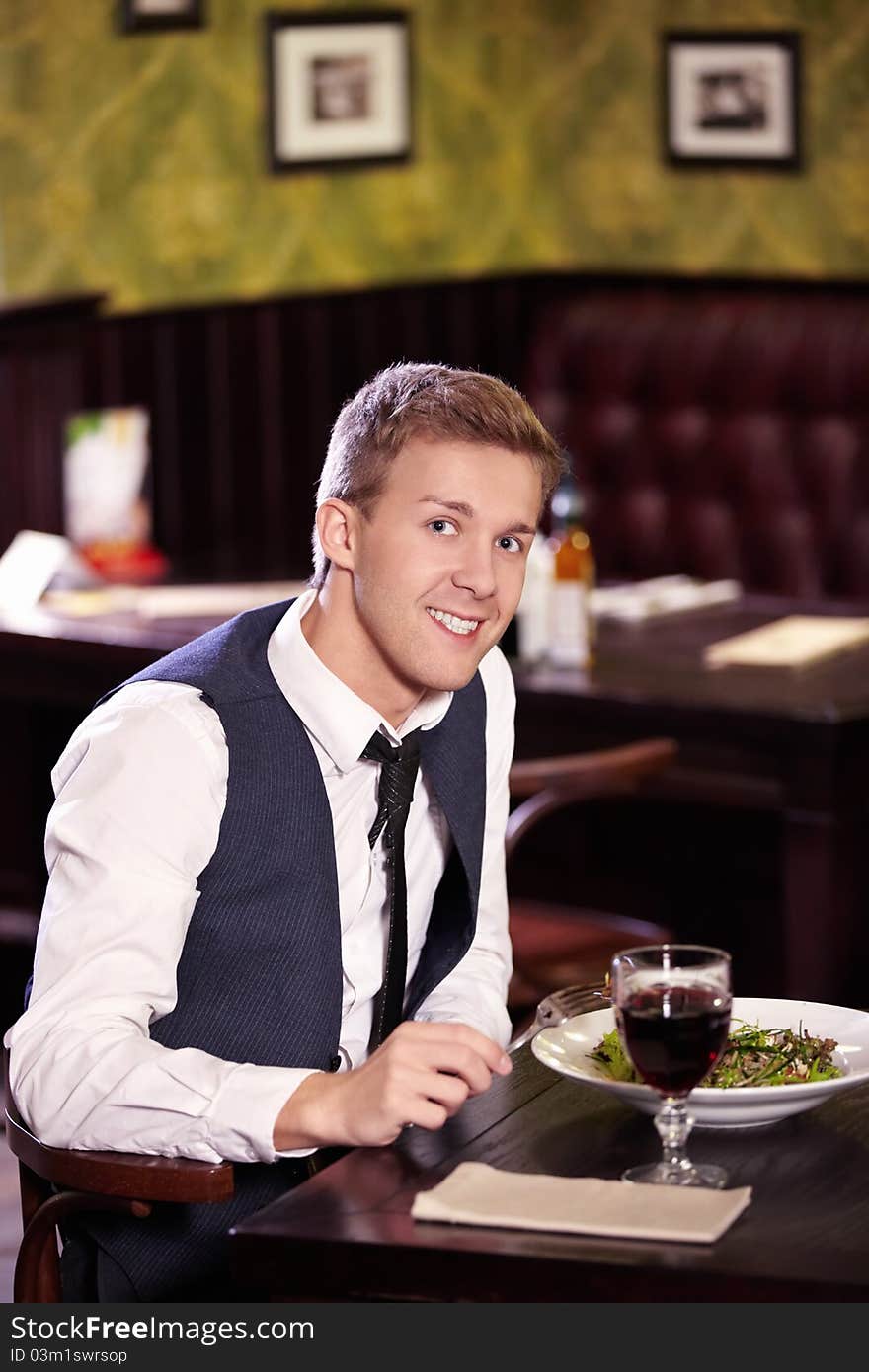 A young man in a restaurant. A young man in a restaurant