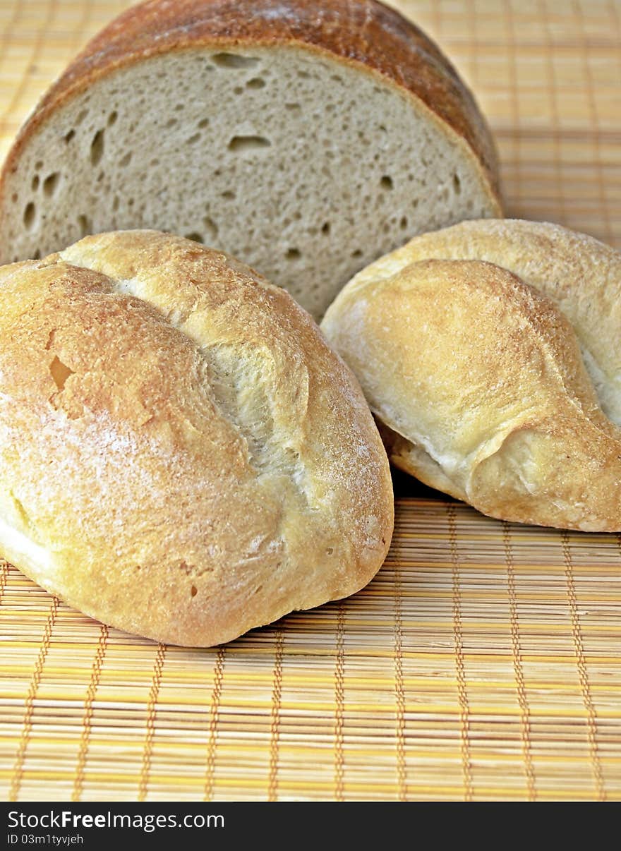 Bread and two rolls on table