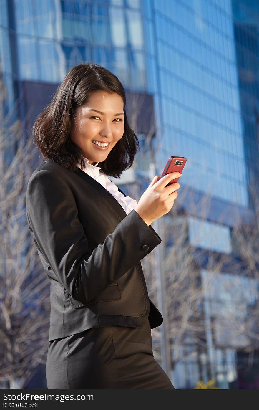 Portrait of a cute asian business woman over business center on back. Portrait of a cute asian business woman over business center on back