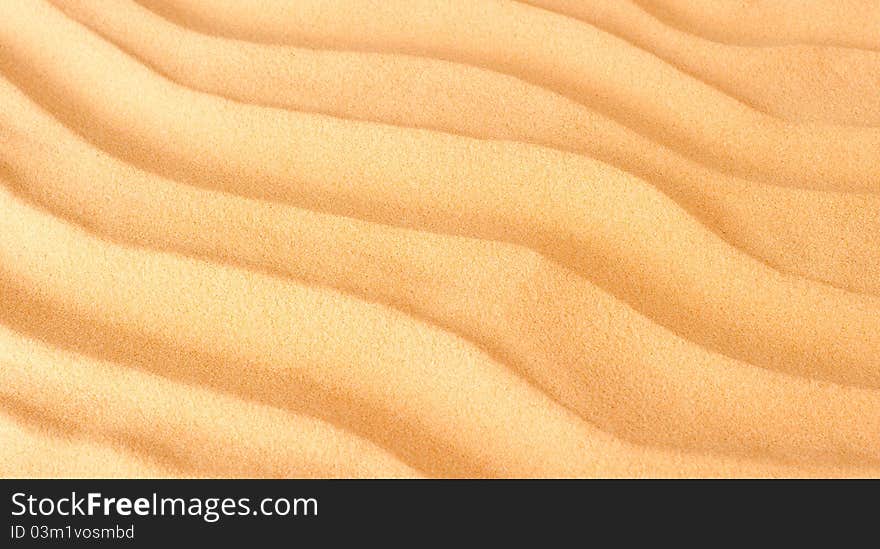 Closeup sand background with waves