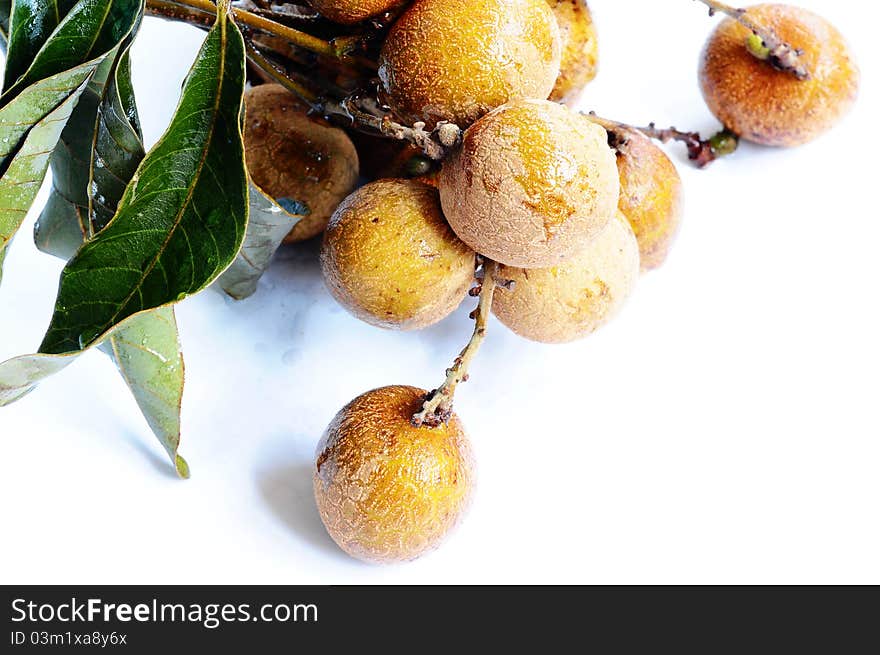 Fresh ripe longan fruits on a white background