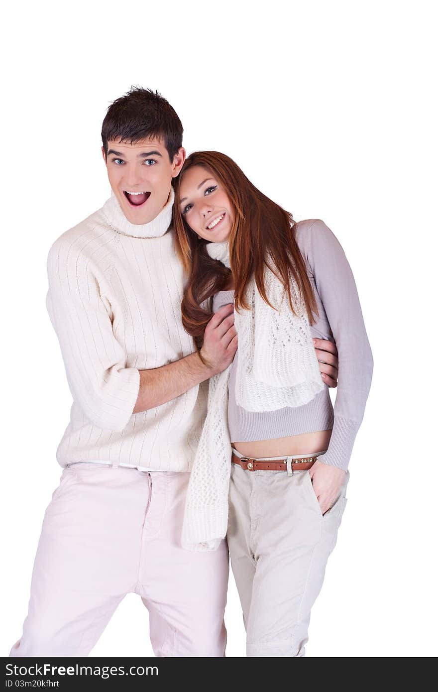 Young fashion expressing teenagers embraced smiling; isolated