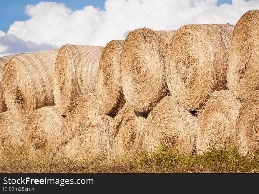 Stack of hay bales drying outdoors