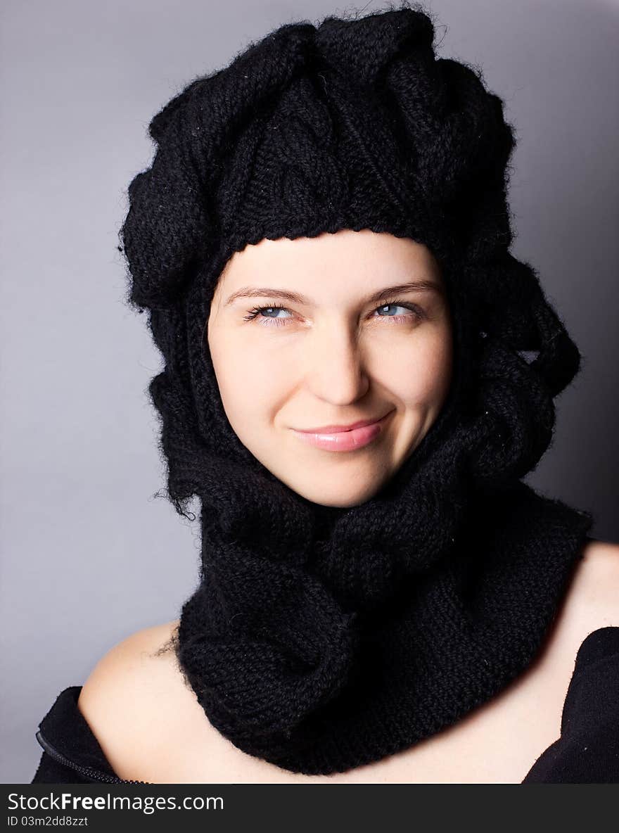 Portrait of smiling woman in cap