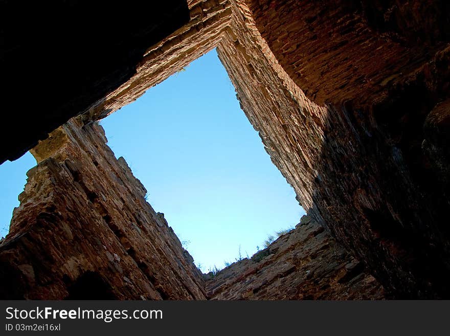 A view to the sky through an old ruins