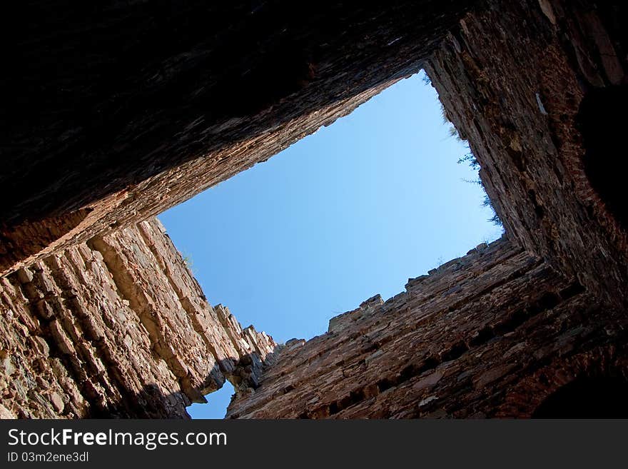 A view to the sky through an old ruins