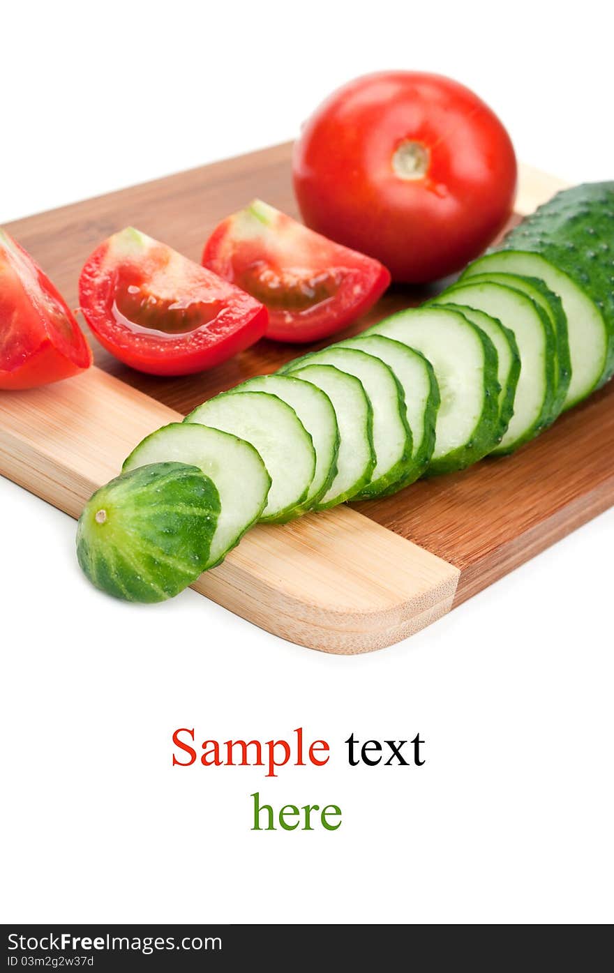 Fresh red tomato and cucumber isolated on a white background