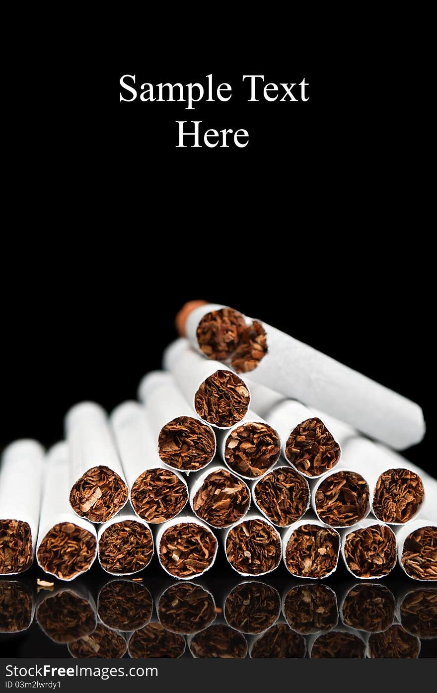 Many cigarettes isolated on a black background