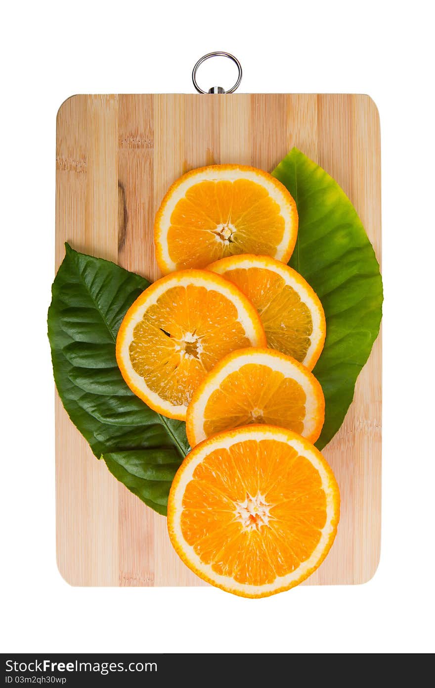 Fresh juicy orange on wooden cutting board isolated on a white background. Fresh juicy orange on wooden cutting board isolated on a white background