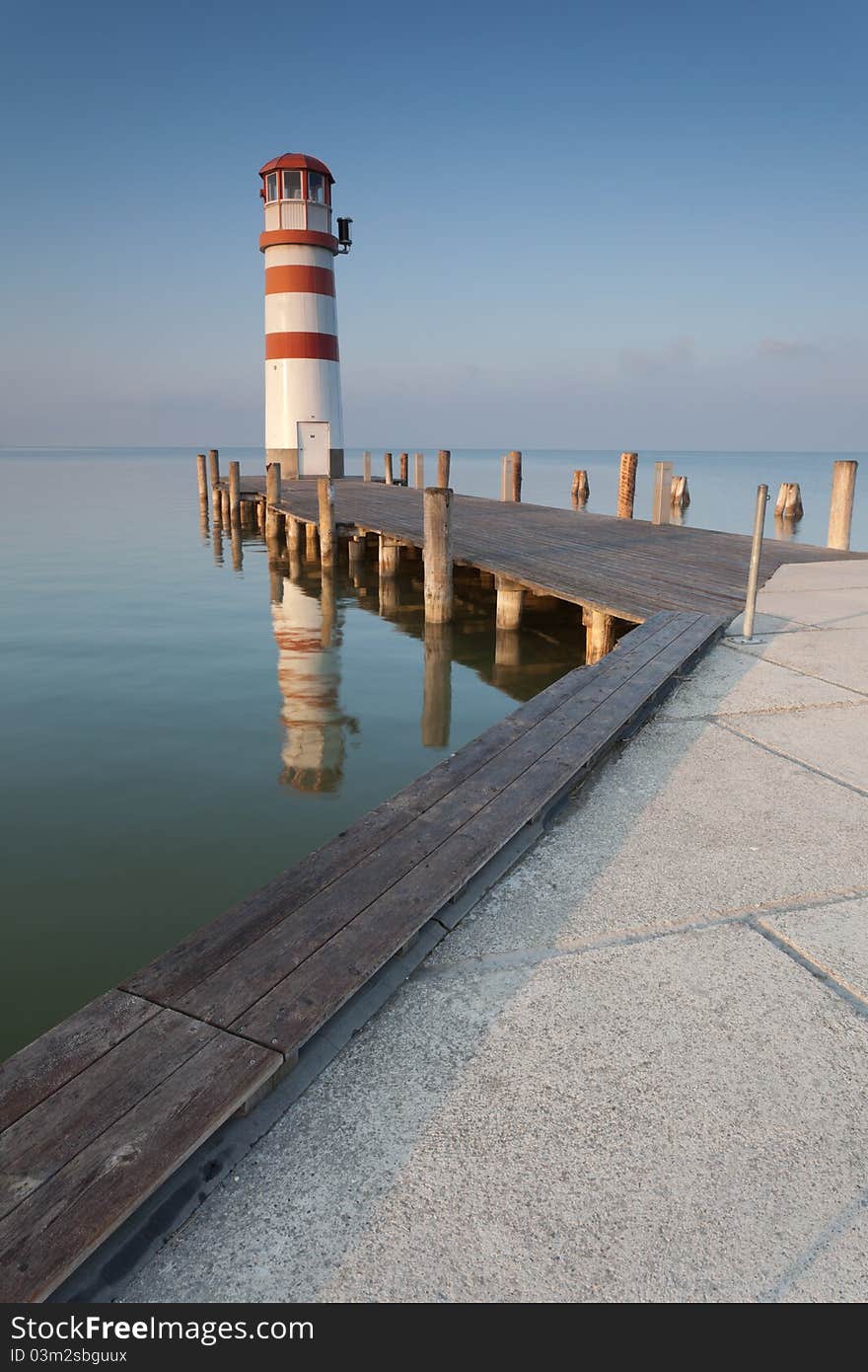 Lighthouse at sunrise in Podersdorf am See which is a small village on lake Neusiedler See, Burgenland, Austria. Lighthouse at sunrise in Podersdorf am See which is a small village on lake Neusiedler See, Burgenland, Austria