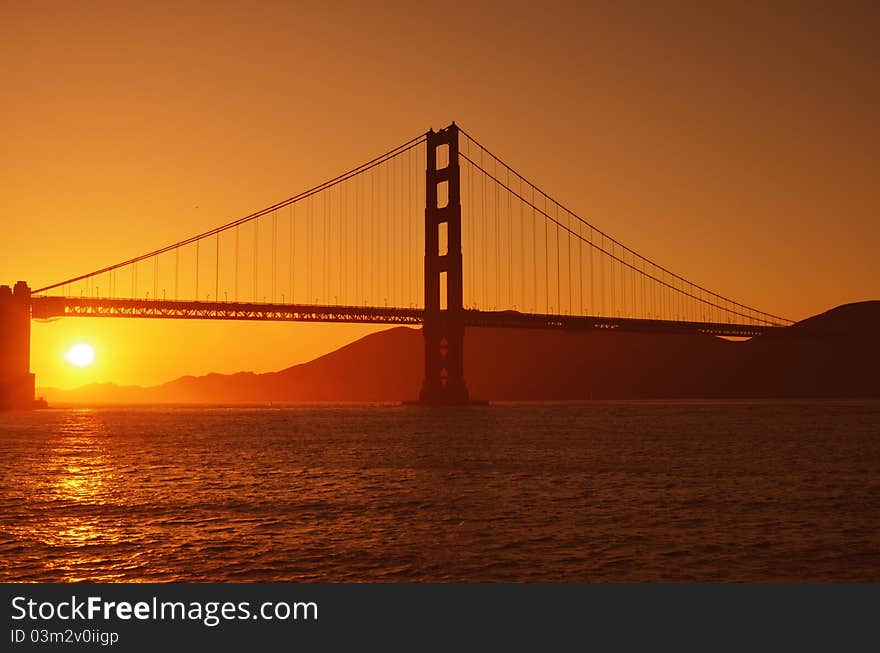 Golden Gate Bridge in a brilliant orange sunset